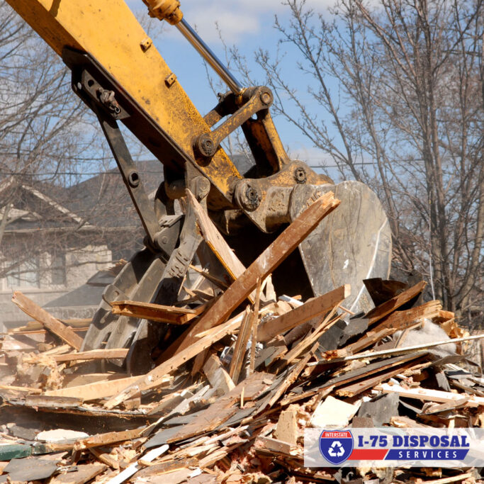 Crane removing demolition debris