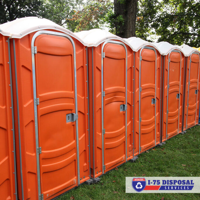 Orange portable restrooms